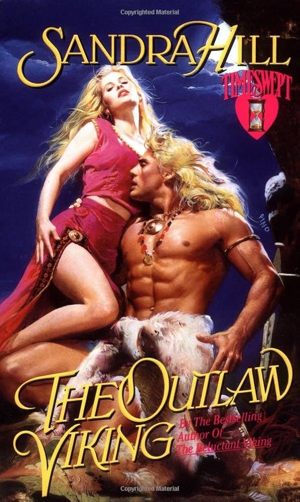 Ok so this is a lot. A blonde woman with long hair is looking down her nose at the reader wearing a pink two piece outfit with a tank top and skirt, the skirt is slit up to her tush and she's pulling back the skirt to show a bent leg. There's a gold amulet at the top of the fabric slit. Then there's deSalvo. deSalvo is blonde in this one, long blonde hair, with a lot of ab muscles, an amulet that looks like the Beastmaster wore it, and a white furry thing on his loins. He is kneeling in front of the woman but..it looks like his legs are detached? The title is THE OUTLAW VIKING