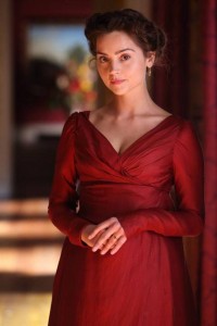 Lydia's dress, a shiny fabric deep wine red vneck with a draped bodice and long sleeves it's gorgeous like goddam whoa