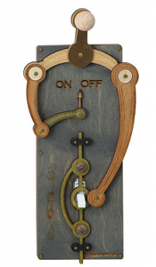 Lightswitch with wooden gears and levers to turn the off on switch into a right left lever 