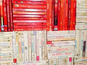 A Close up of the artwork - the spines appear to be all Mills and Boon and Harlequin novels 