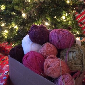 A box of yarn under the lights of the christmas tree