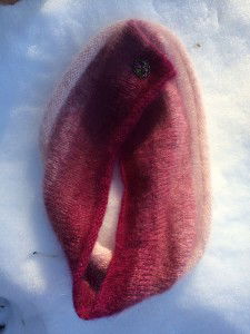 Pink fuzzy cowl folded so it looks just like a giant fuzzy vulva