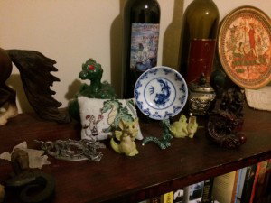 Reidan's dragon collection - pillows, figurines, stitching, plates and cups all featuring dragons