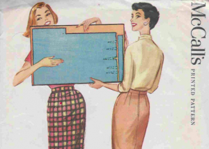 Two women holding an enormous file folder wearing very long pencil skirts