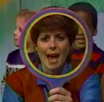 Romper Room screenshot of Miss Molly looking through a mirror frame and saying who she sees