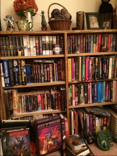 Science fiction paperbacks are not as pink. Mostly blue and black spines. 