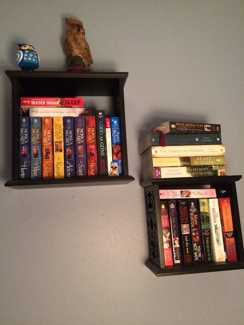 Close up of more floating shelves, with owls on top