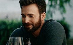Chris evans looks up and smiles