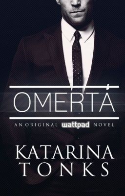 Omerta - a black and white photograph of a dude in a suit from the nose down