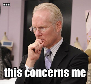 Tim Gunn from Project Runway with his hand over his mouth, in a loose fist, and the caption ... This Concerns Me