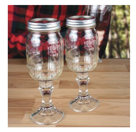 Two mason jars with wine glass bottoms and metal screw tops, sold as rednek wine glasses. They are adorable and $10.21 each. 