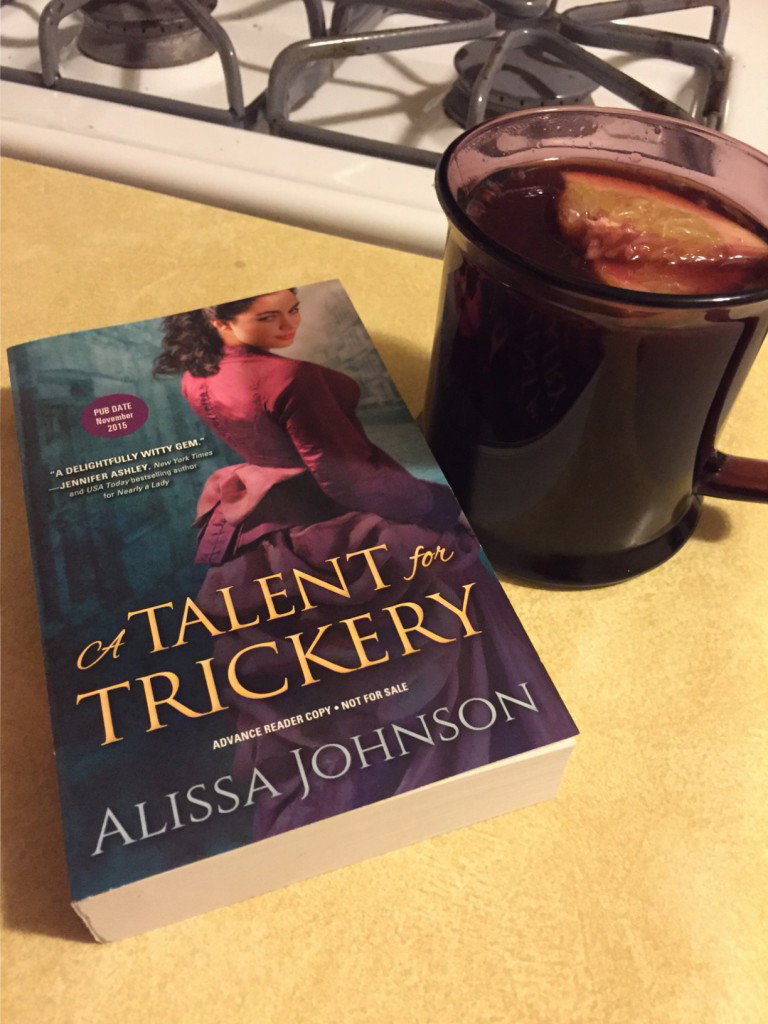 A Talent for Trickery with a glass of mulled wine