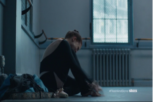 Claire pounding her toe with her pointe shoe