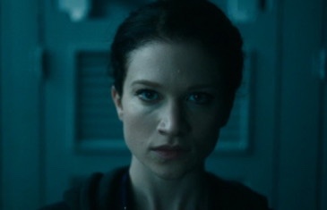 Claire staring at herself in the mirror before she pulls out a bobby pin and stabs herself in the scalp