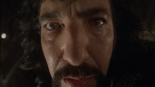 closeup of Rickman from Prince of Thieves, sweaty and distorted by camera angle and STILL good looking