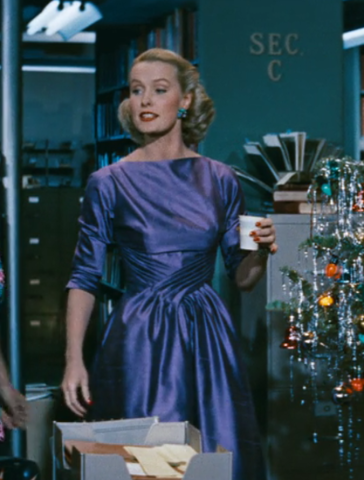 Sylvia's purple dress, gathered across the waist in an X of ruffles and a neckline that's straight across her collarbone. It's gorgeous.