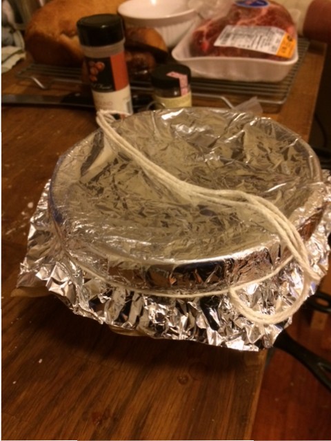 Tied up and ready to steam. The string is tied like that so the basin can be pulled out of the boiling water without burning your fingers off.