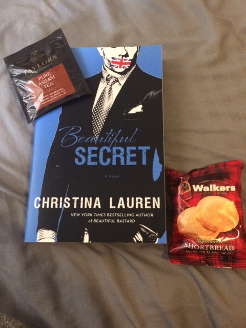 A copy of beautiful secret, a packet of Taylor's tea, a packet of Walkers shortbread and a tiny vibe