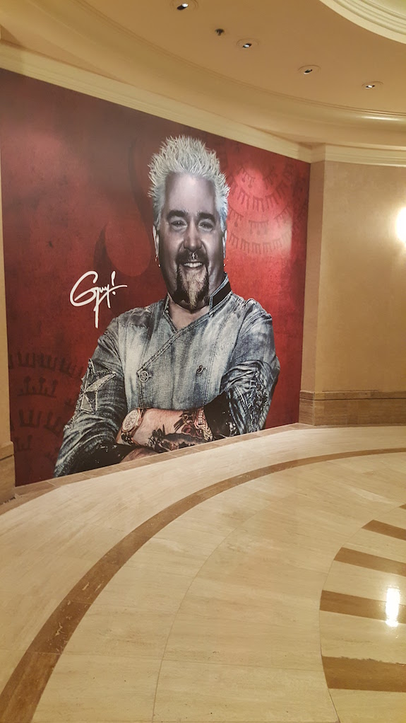 Guy Fieri on a wall billboard