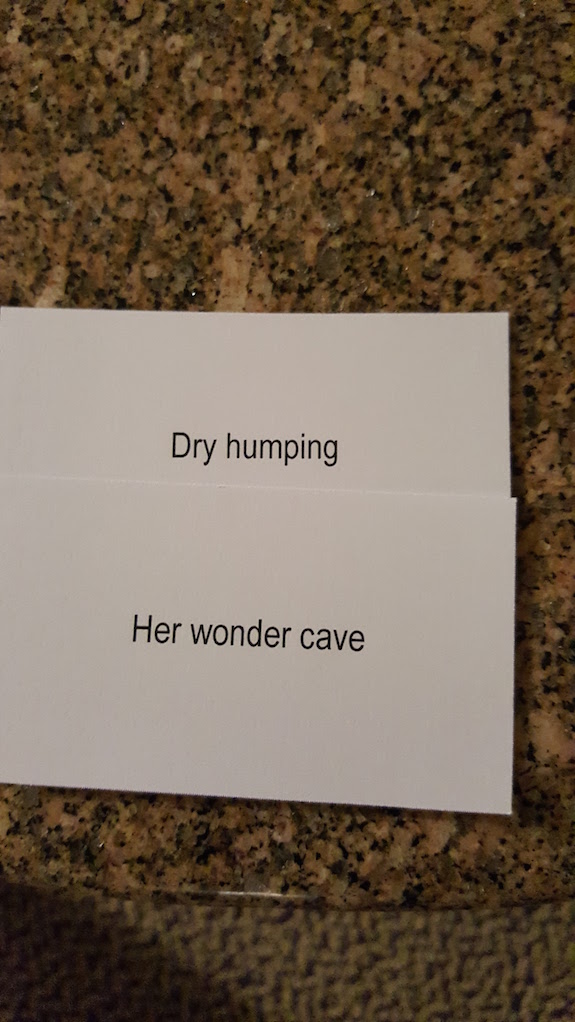 Close up of two cards that read DRY HUMPING and HER WONDER CAVE