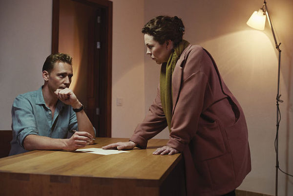 Pine and Angela talking intently.