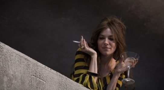 Charlotte, complete with drink and cigarette