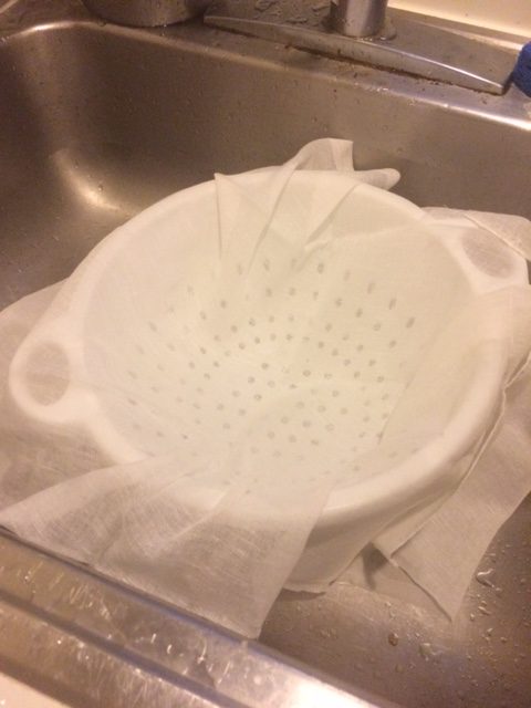Cheesecloth in the colander, waiting for curds and whey.