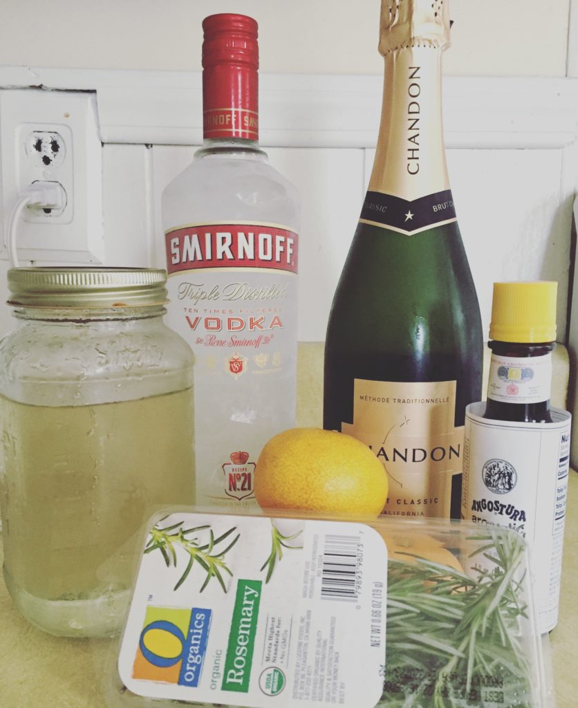 Ingredients for the Sweet Hot Christ - vodka, champagne, simple syrup, aromatic bitters, rosemary, and clementine juice.