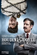Houdini and Doyle poster with doyle on the ground in a suit and mustache while Houdini hangs upside down in a strait jacket wrapped in chain