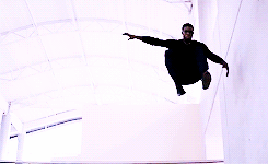 Sam dropping down and landing, looking suspicious and ready to kick ass