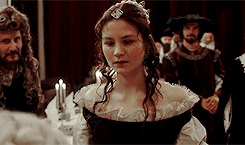 Countess Ebba bowing to Queen Kristina, who looks confused and interested 