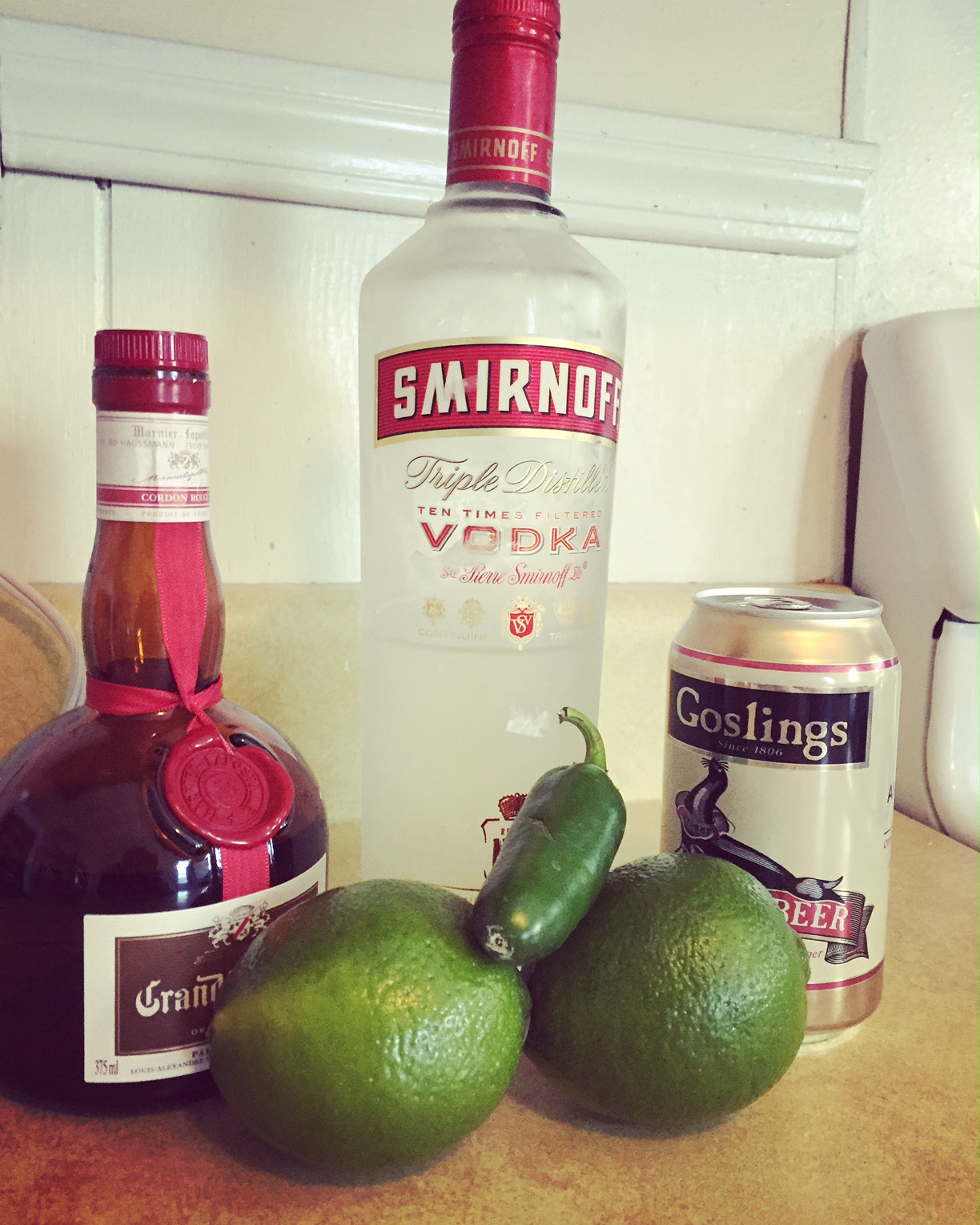 Ingredients for Cooper's Bite (a spicy Moscow mule) vodka beer, lime, hot pepper, grand marnier