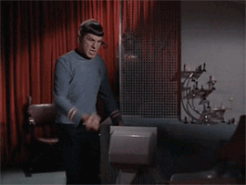Spock crushing something with his fist. Possibly something made of metal