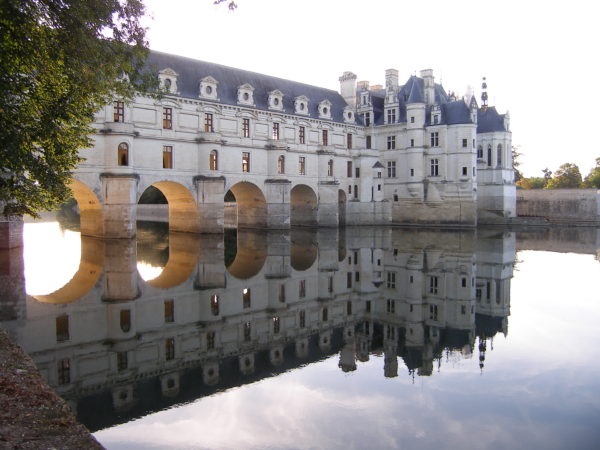 the castle reflected in the river