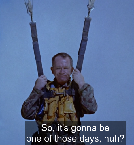 Man trapped in a parachute with the caption, "So it's gonna be one of those days, huh?"