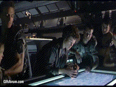 Hicks liftes Newt onto the blueprint table.