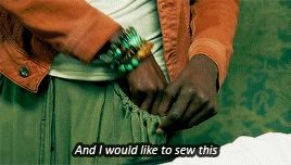 Rutina pulling a small sewn bag out of her pocket saying she'd like to sew it into the casket satin