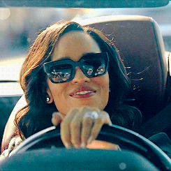 Dawn-Lyen Gardner smiling behind the wheel of her car 