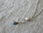 Stitch Marker Necklace - a small loop of wire with a seed pearl stitch marker attached to it, hung on a long silver chain