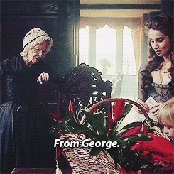 Elizabeth and Agatha, looking at this giant fruit basket, and Elizabeth announcing that it's from George.
