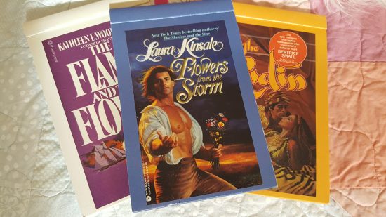 matchbox style notepads featuring The Flame and the Flower, Flowers from the Storm, and The Kadin 