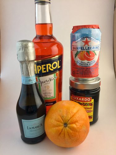 Ingredients for a blood orange Aperol spritz