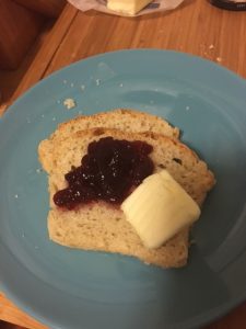A slice with lingonberry jam and butter.