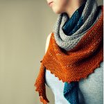 A picture of the Ashburn shawl in orange, grey and blue