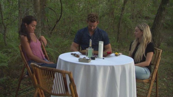 Taylor, NIck and Corinne sit around a table in the middle of the bayou. They all look suuuuuper awkward.