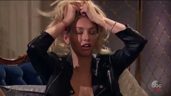 Corinne has her fists in her hair and an OMG can you believe all this poop? expression on her face.