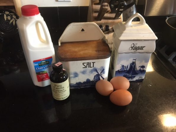 Milk, vanilla, eggs, and salt and sugar which are in big blue ceramic boxes and are very pretty