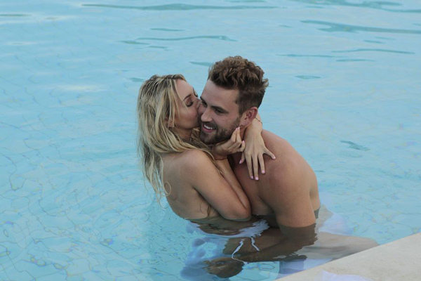 Corrine and Nick cuddle in a pool, she's topless which apparently shocking.