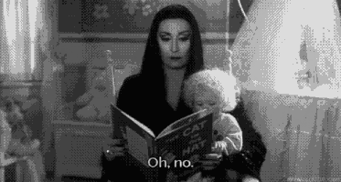 Morticia Addams reading
