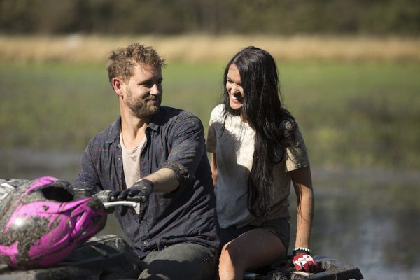 Nick and Raven sit on an ATV together.